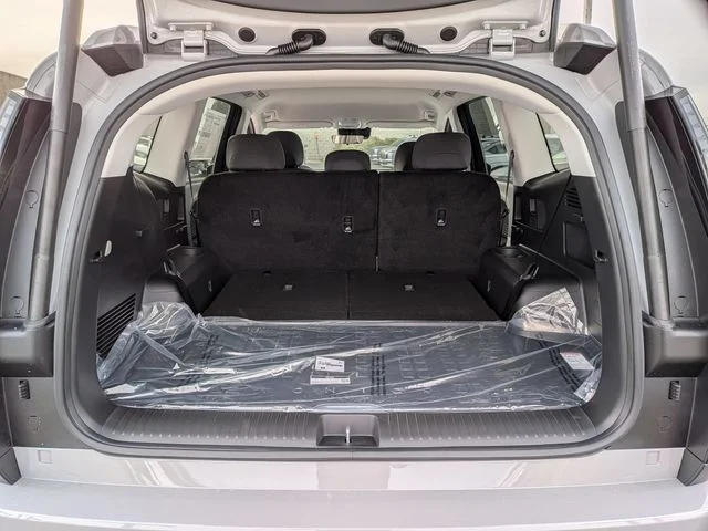 The IONIQ 9 cargo area behind the third row, seen through the open tailgate